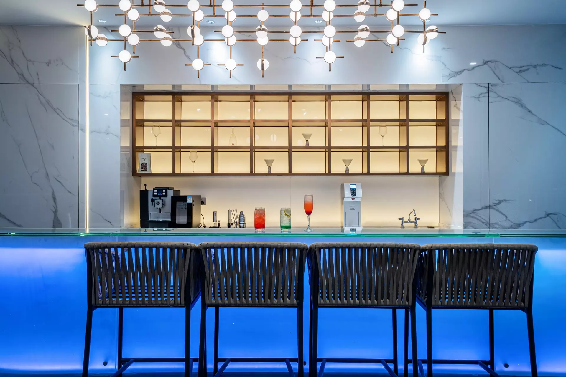 Bespoke wooden integrated cabinetry and shelving for hotel lounge bar