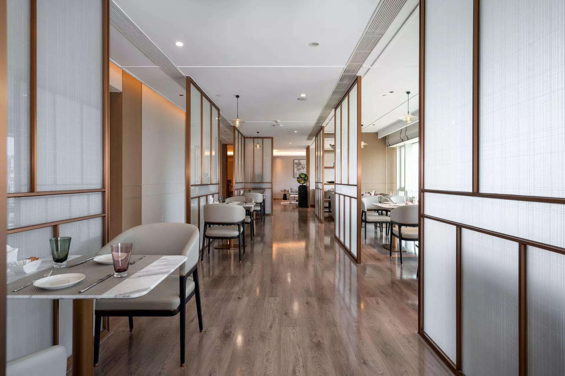 Executive Lounge interior showcasing book-matched wood veneer wall panels