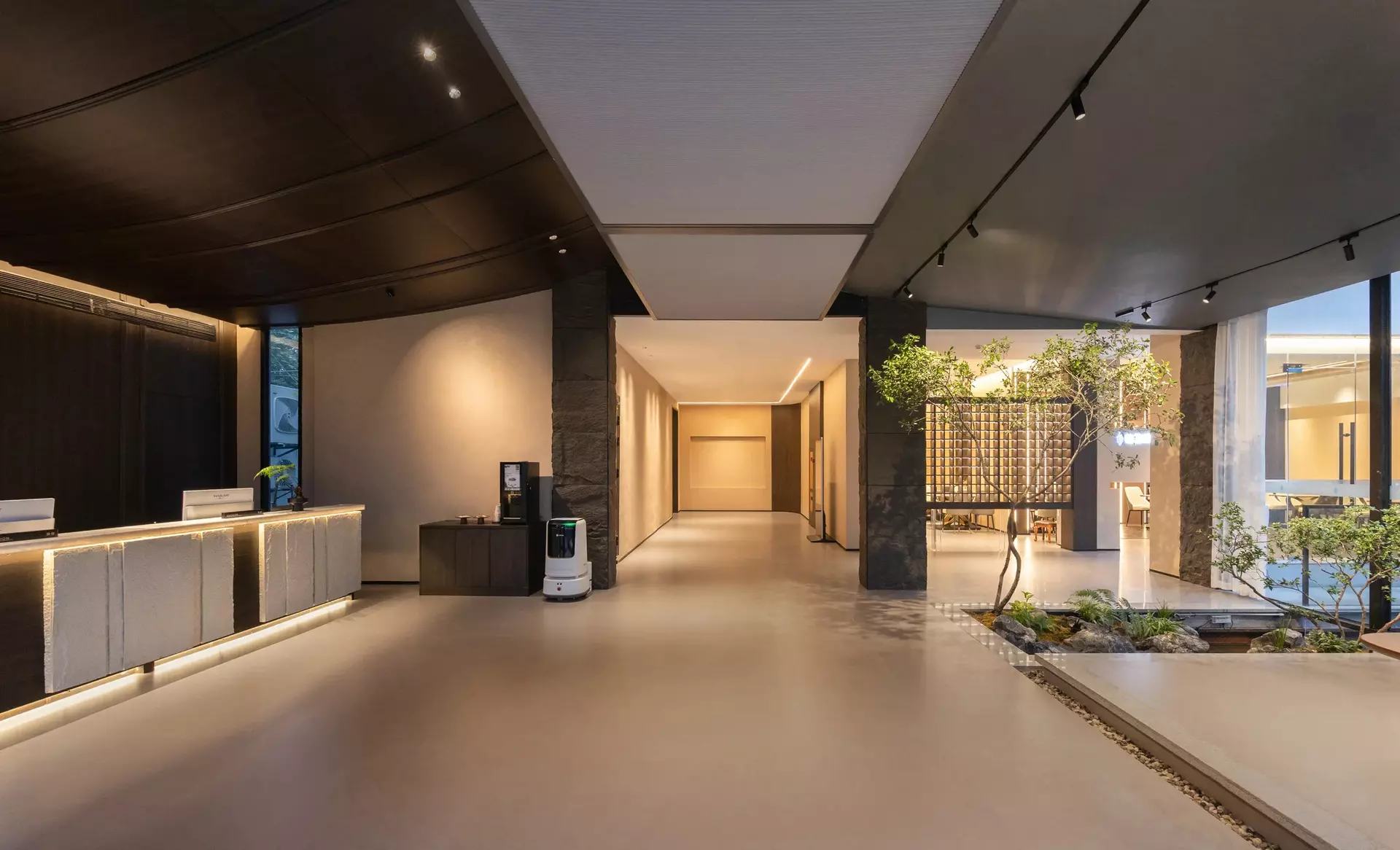 Mehood EZZI Hotel grand lobby featuring customized modern Oriental wood panels